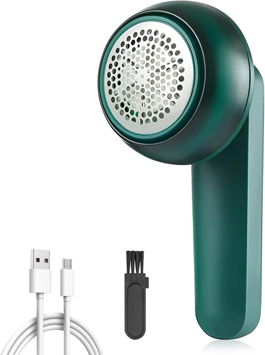 Green fabric shaver with USB cable and cleaning brush on a white background